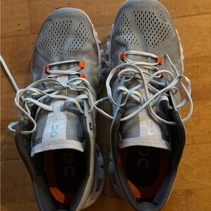 On Running Gray and Orange Athletic Shoes